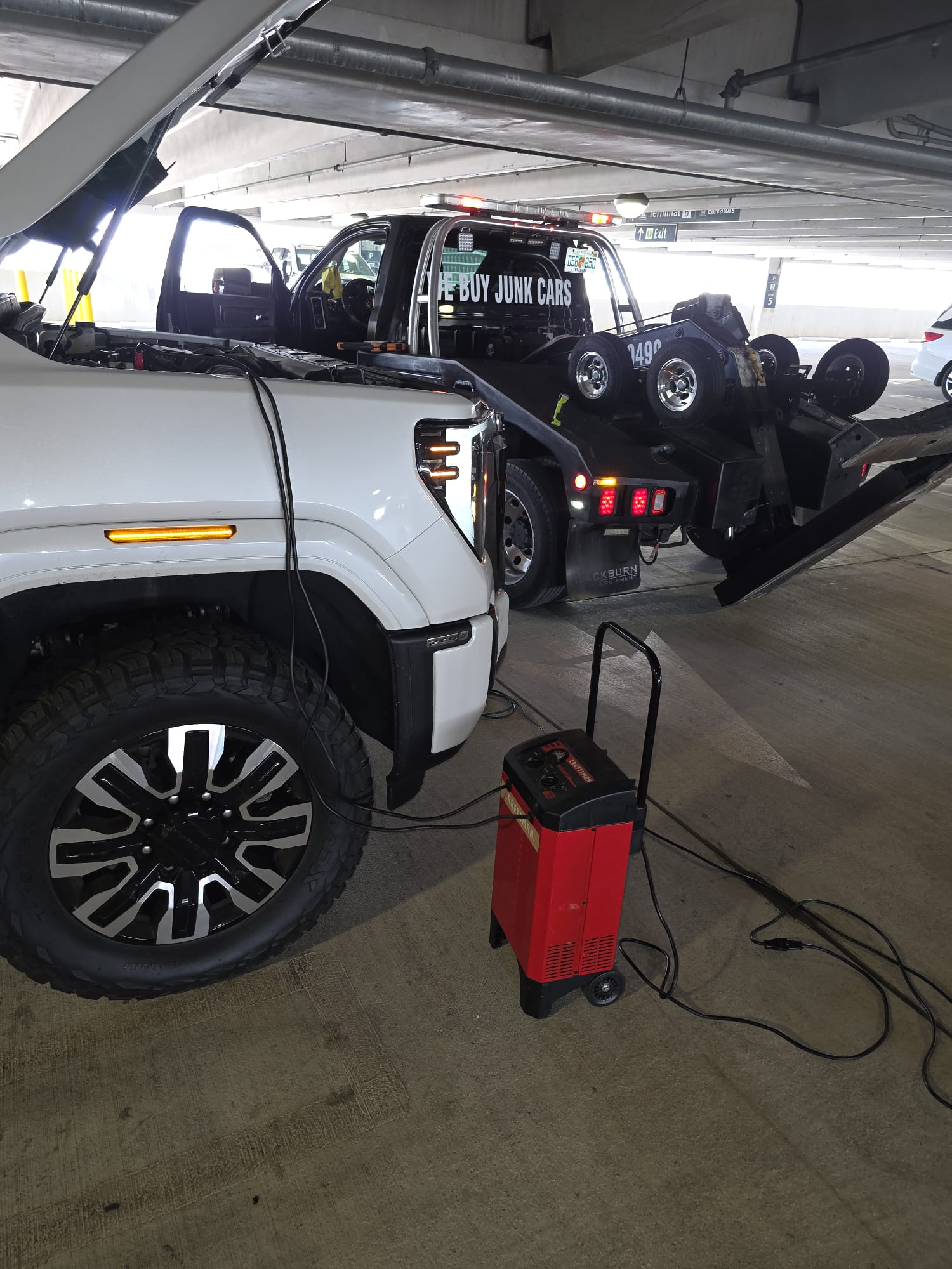 Heavy-duty wrecker recovering a pickup