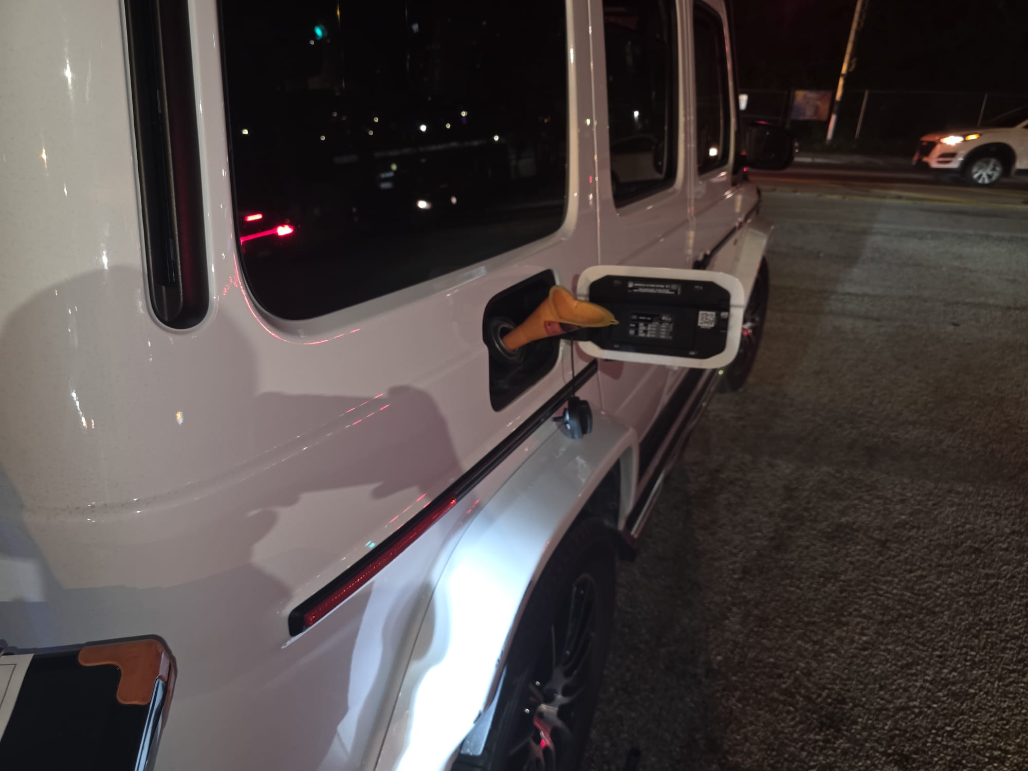 Roadside fuel fill-up on a Mercedes G-Wagon