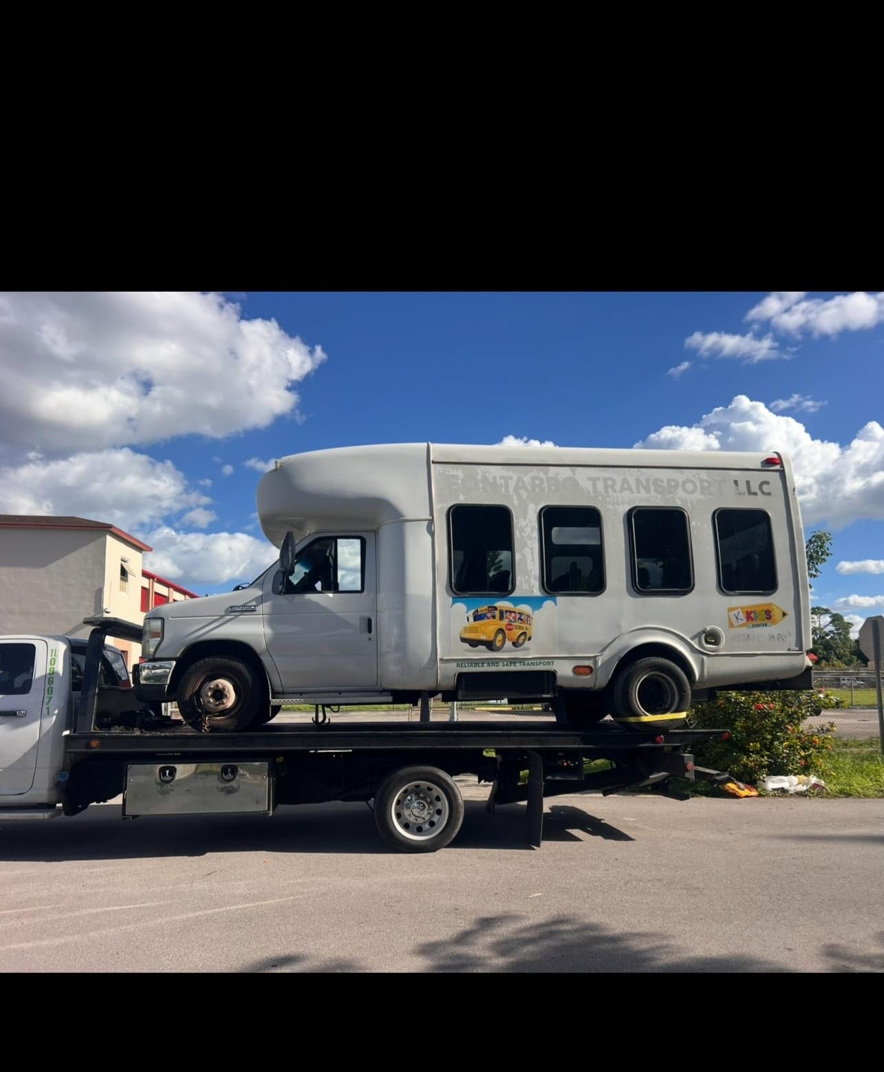 Pintarbo transport bus loaded on flatbed