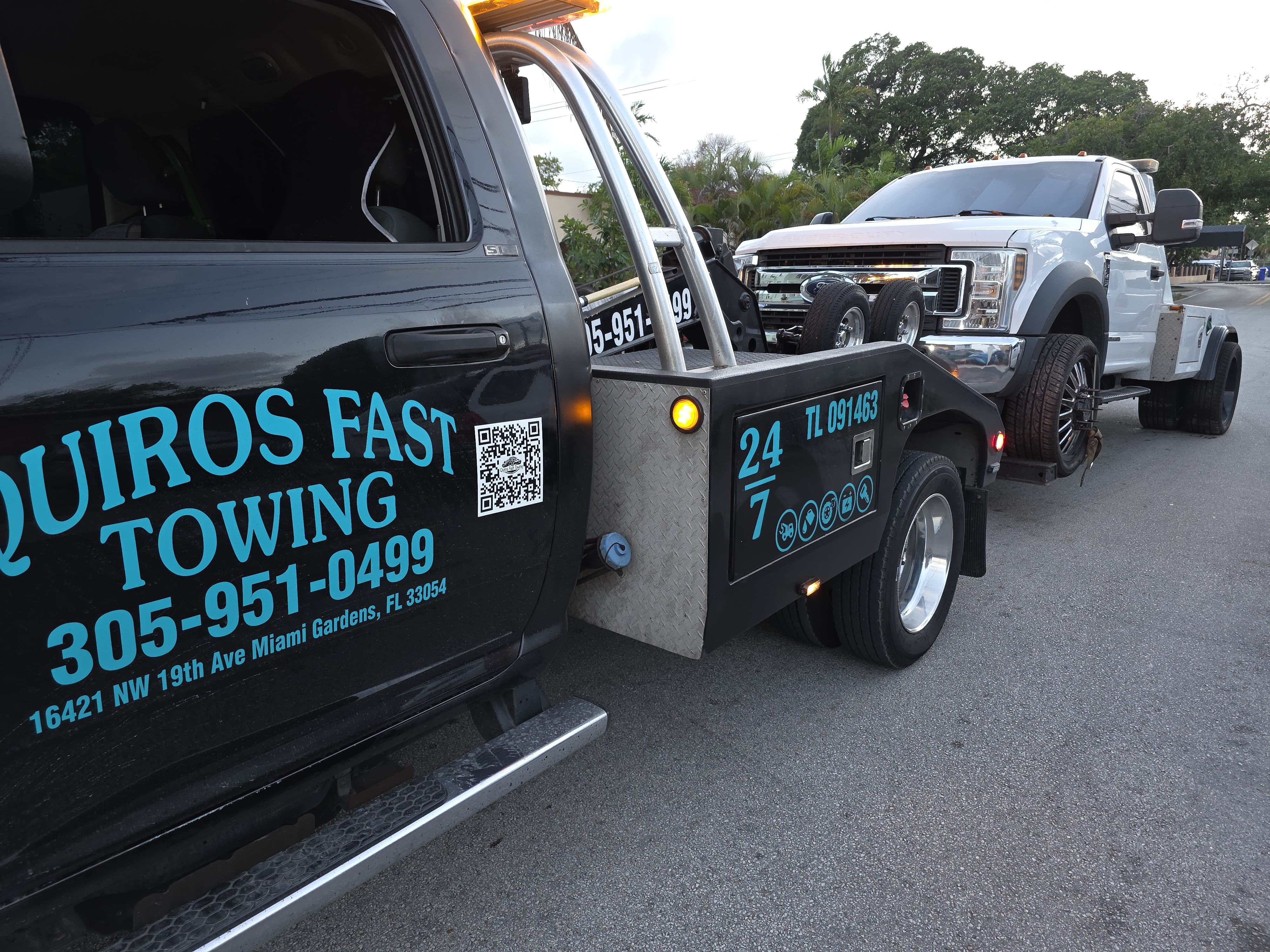 Heavy-duty wrecker towing a Ford Super Duty