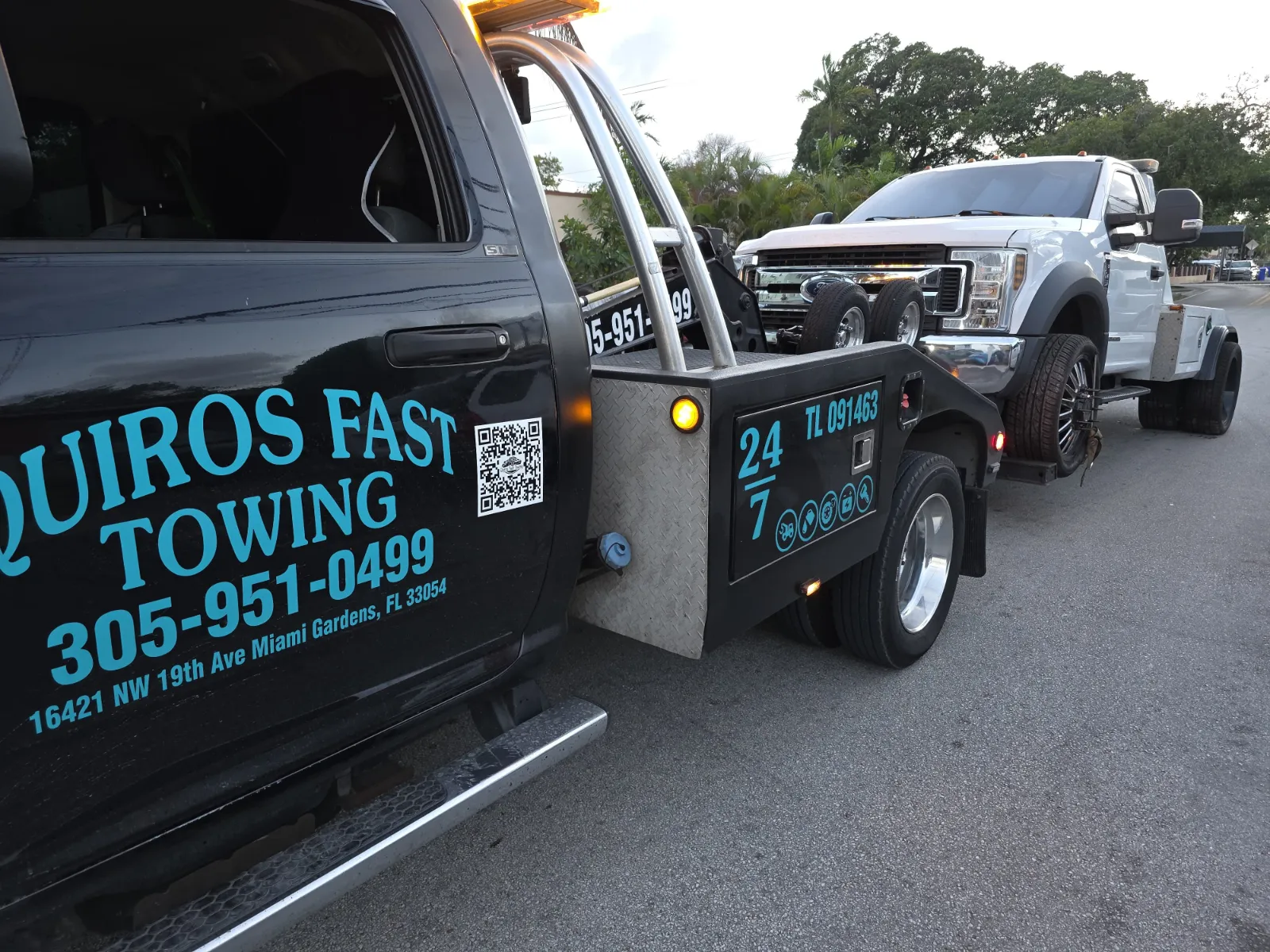 Heavy-duty wrecker towing a Ford Super Duty