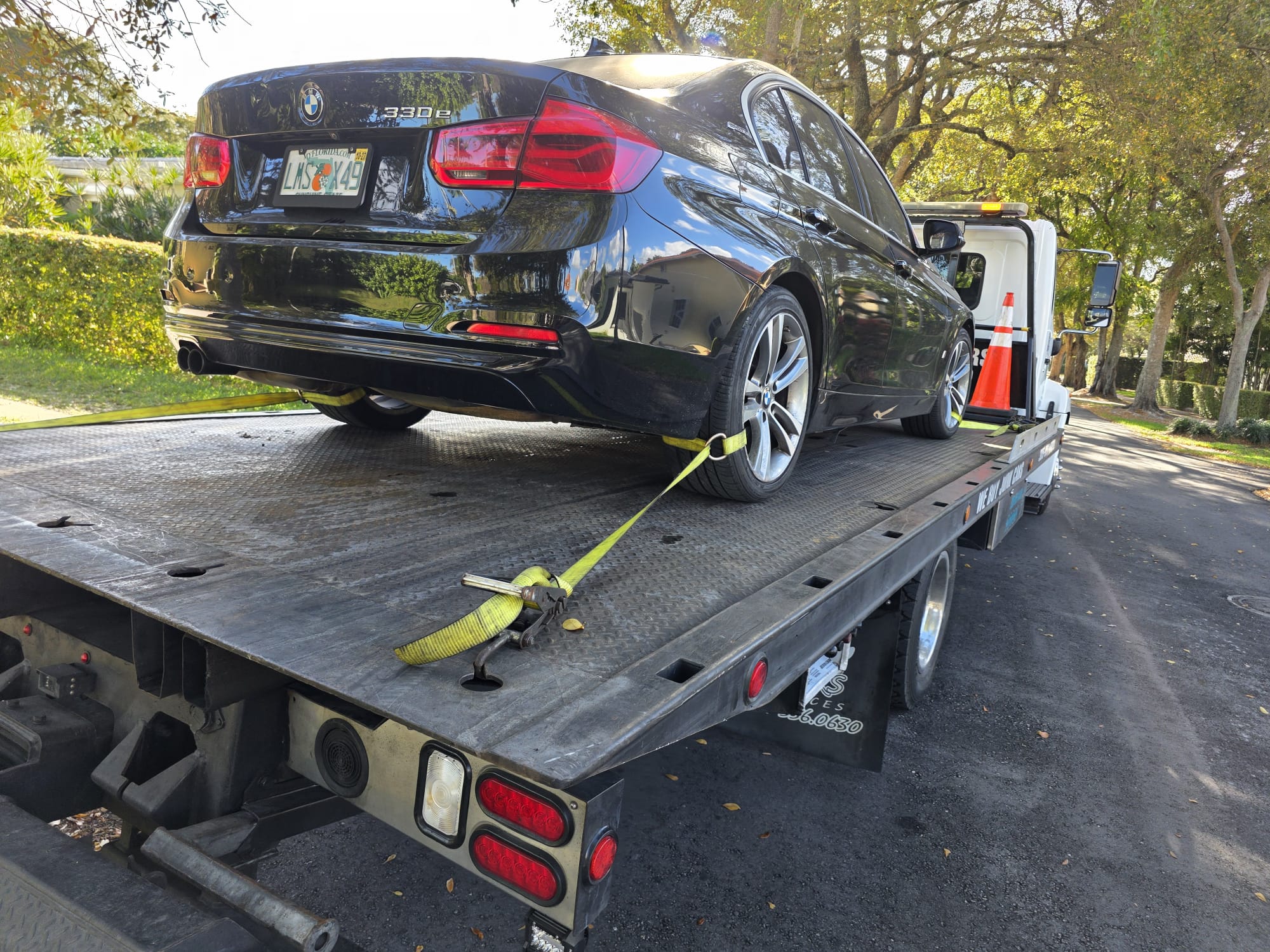 Covered high-value vehicle on flatbed