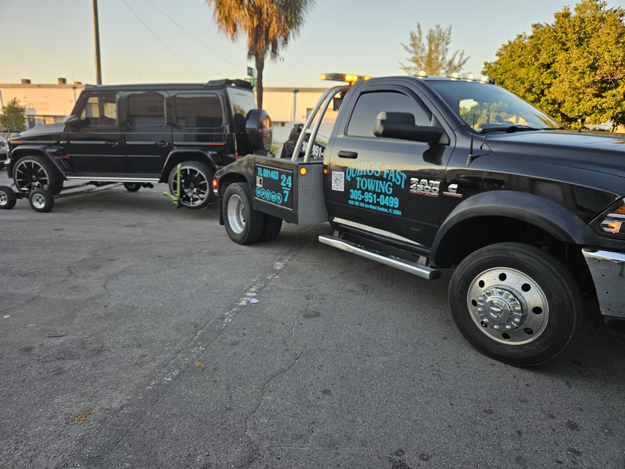 Black Cadillac Escalade on wrecker