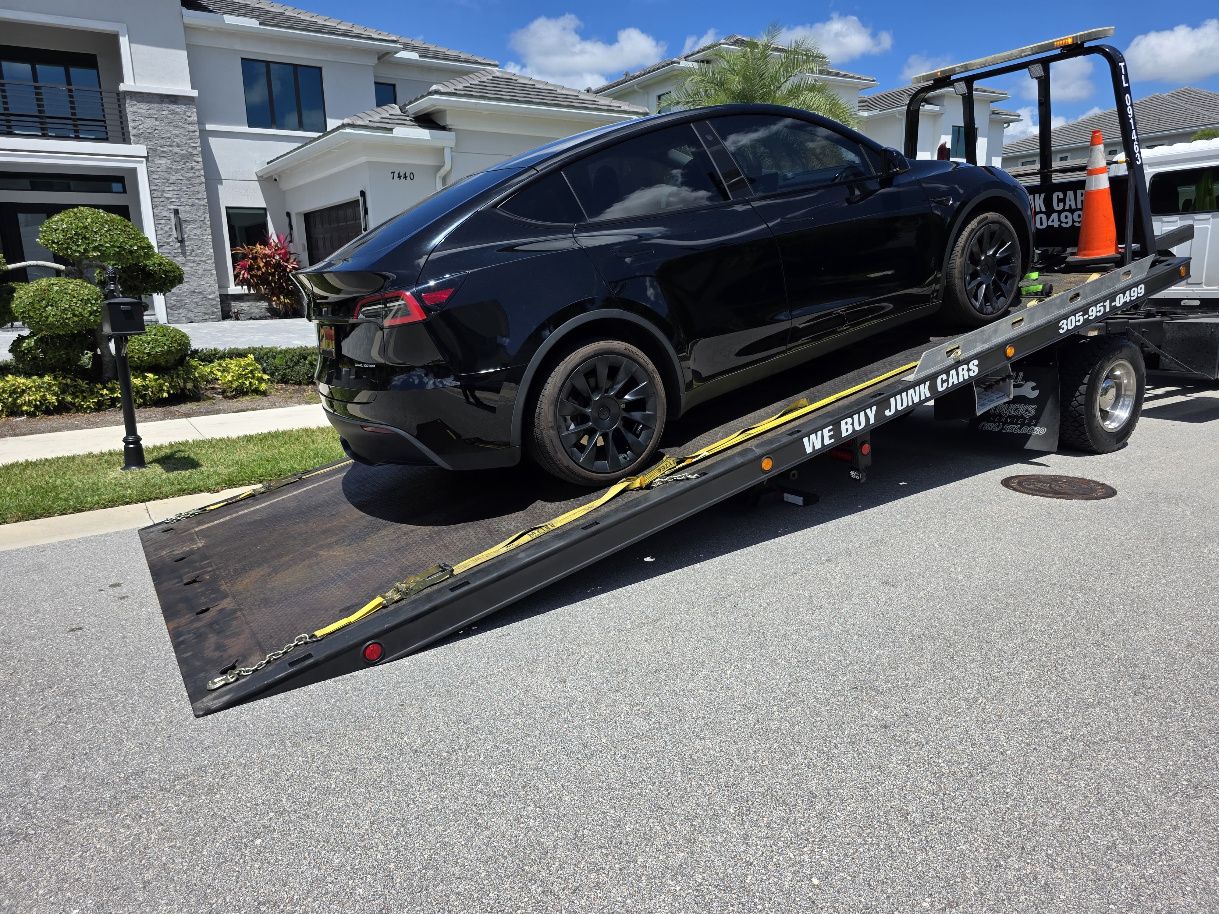 Tesla Model Y secured on flatbed