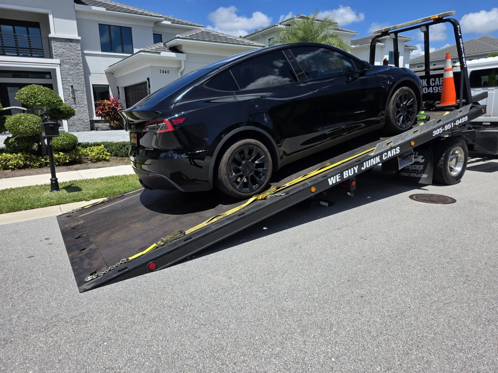 Tesla Model Y secured on flatbed
