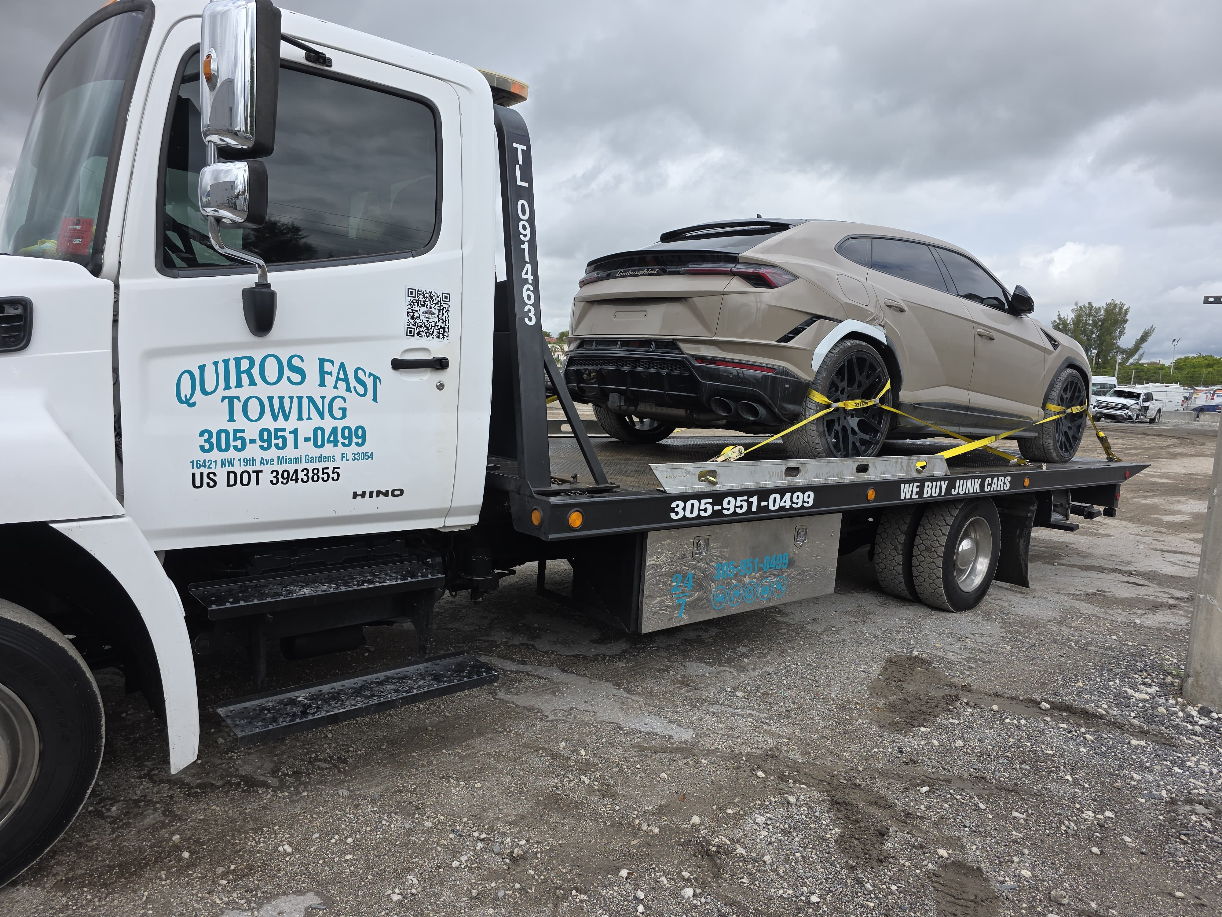 Exotic vehicle secured on a specialty flatbed transport