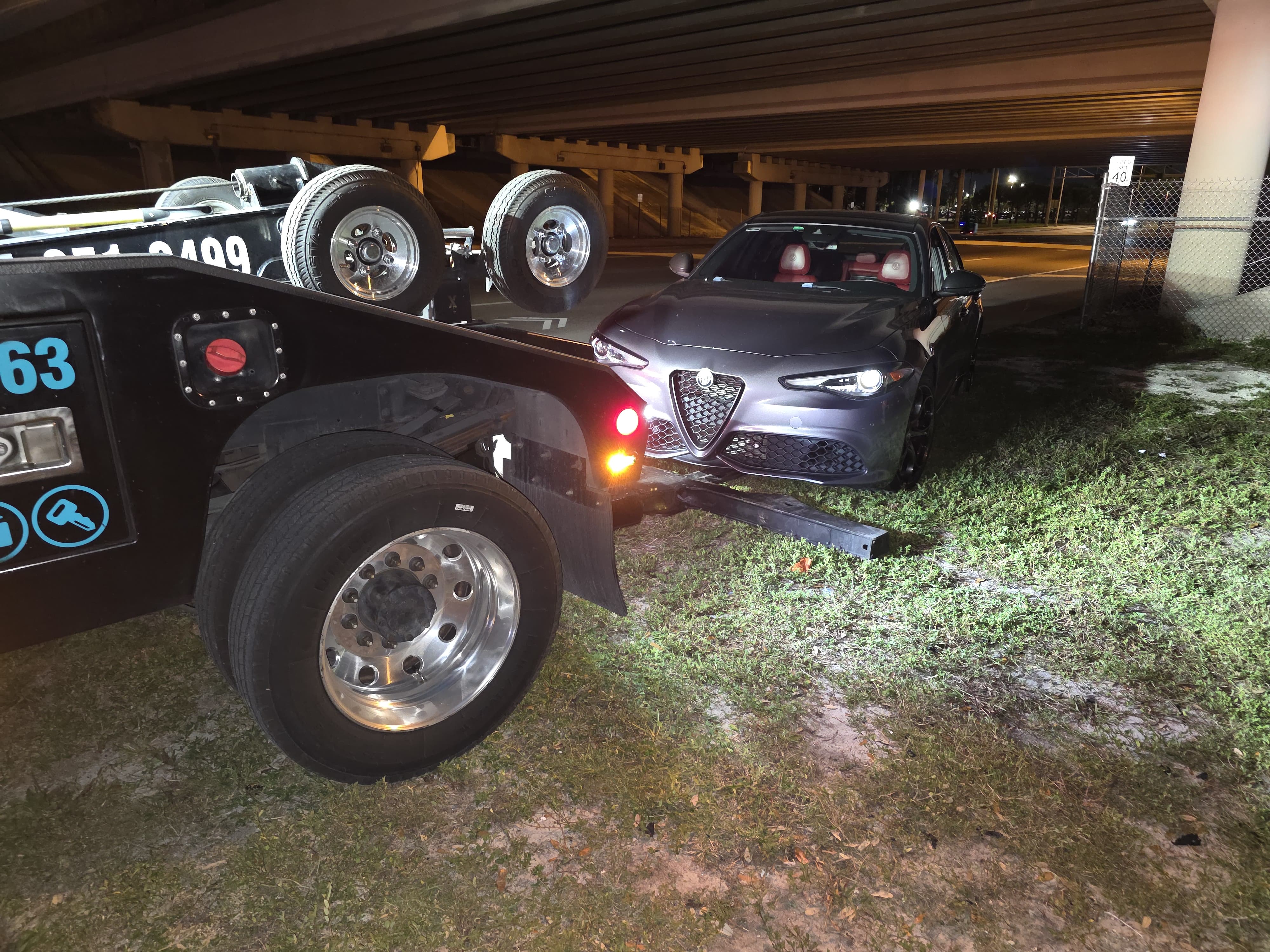 Late-night roadside assistance on an Alfa Romeo Giulia