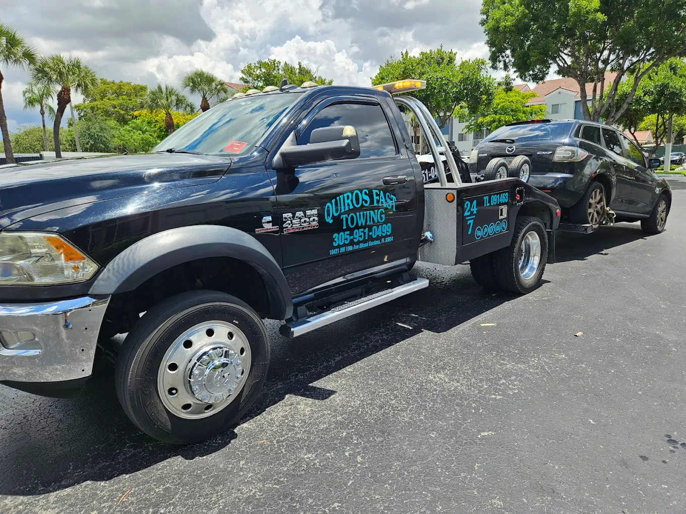 Ram 4500 wheel-lift towing a sedan